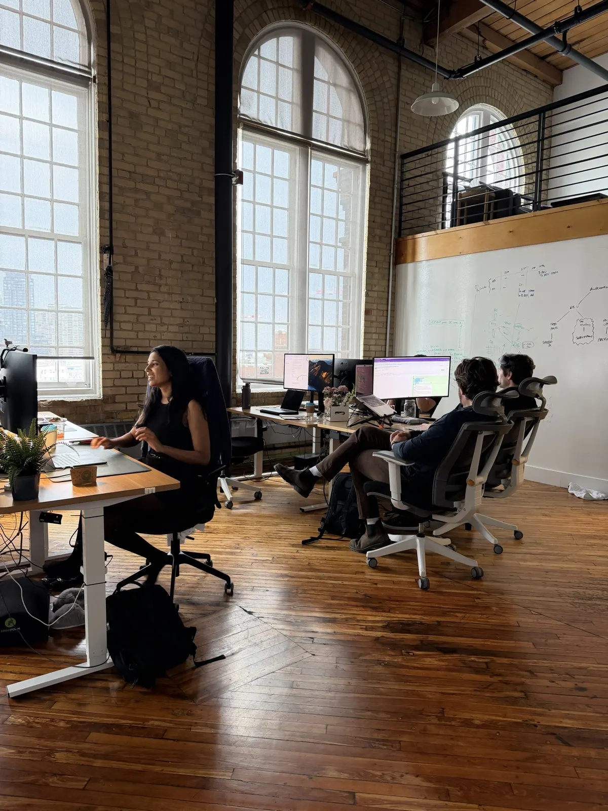 Alloy River team members working together in the office.